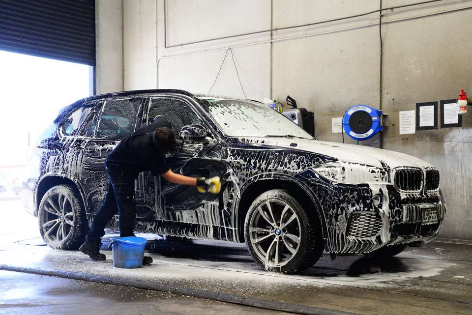 a person washing a car