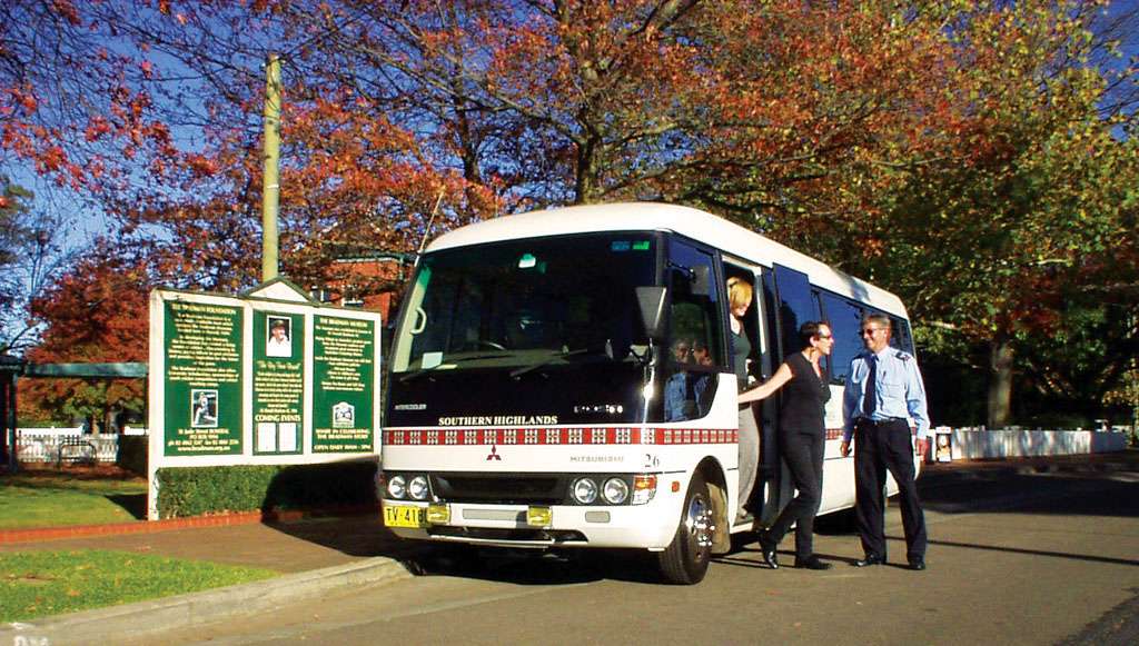 a group of people boarding a bus